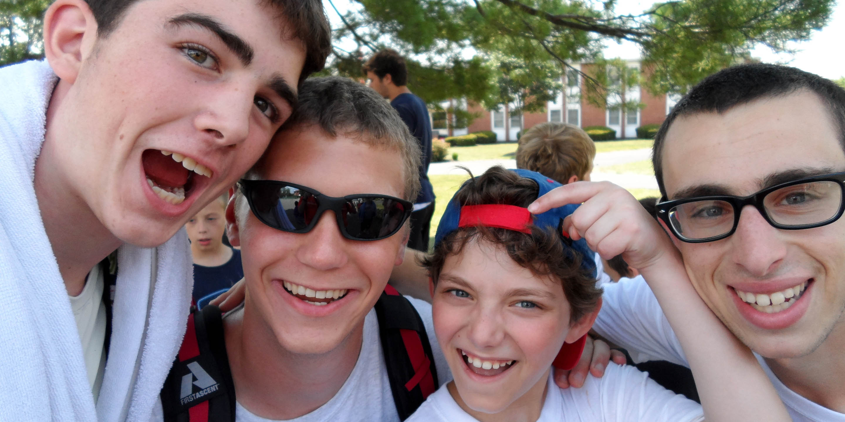 Four boys smiling