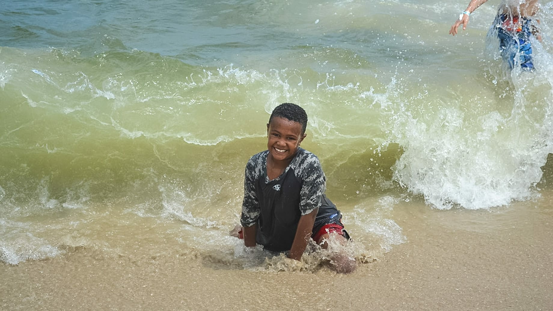 Boy playing on the beach