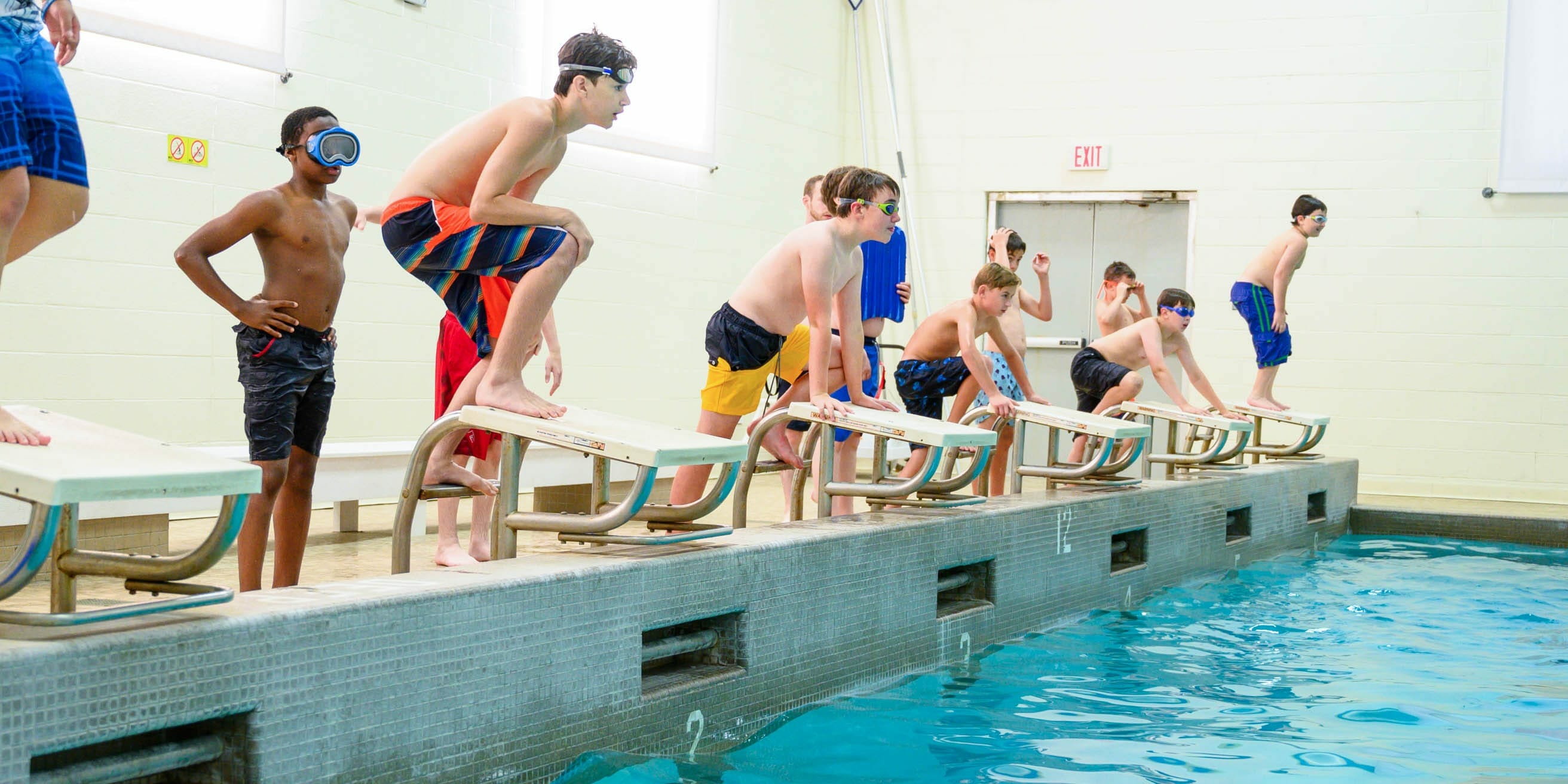 Kids diving into pool