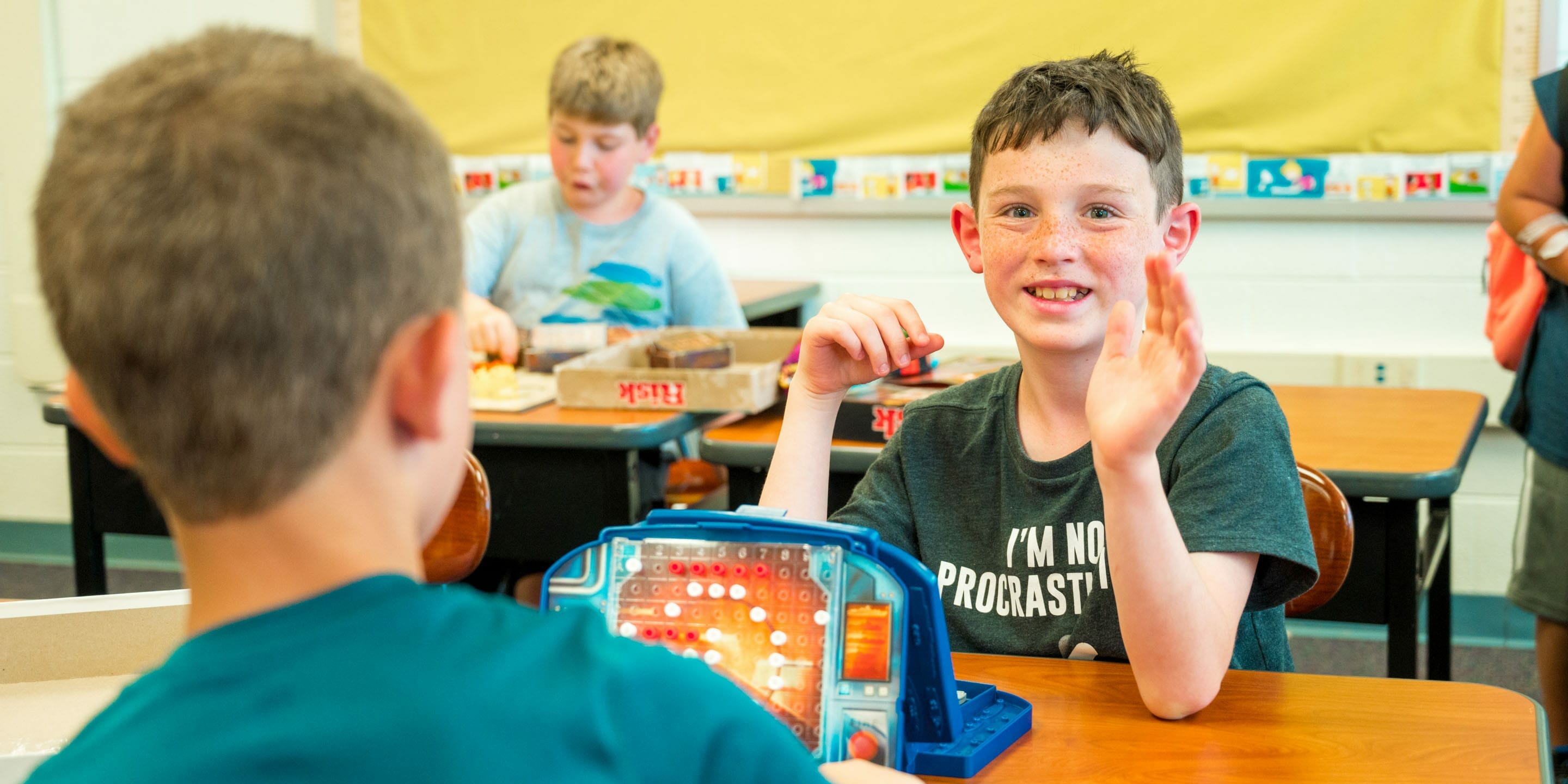 Two campers playing battleship