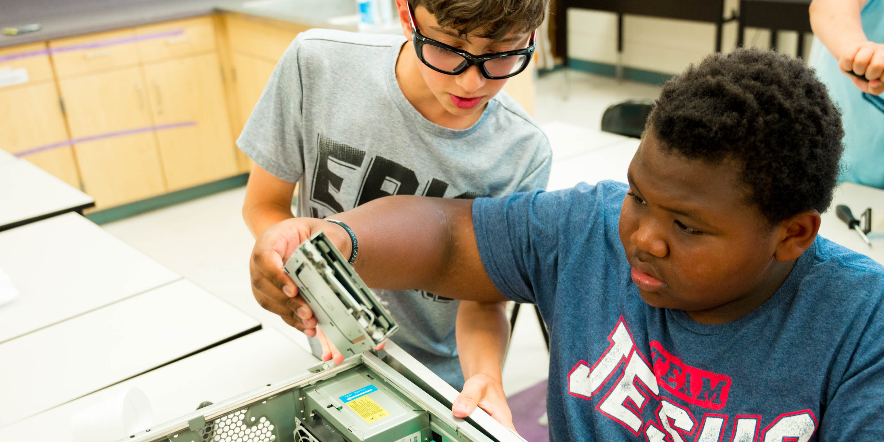 Boys learning how computers are built for STEM